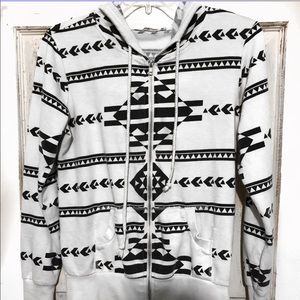 White and black long sleeve sweater.